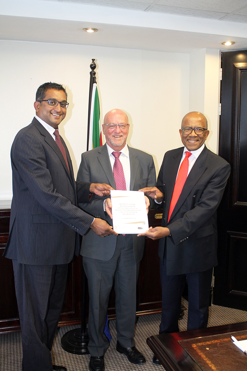 Minister of Tourism Derek Hanekom (middle) and B-BBEE Charter Council Chairperson Mr Monwabisi Fandeso( Right) hand over amended